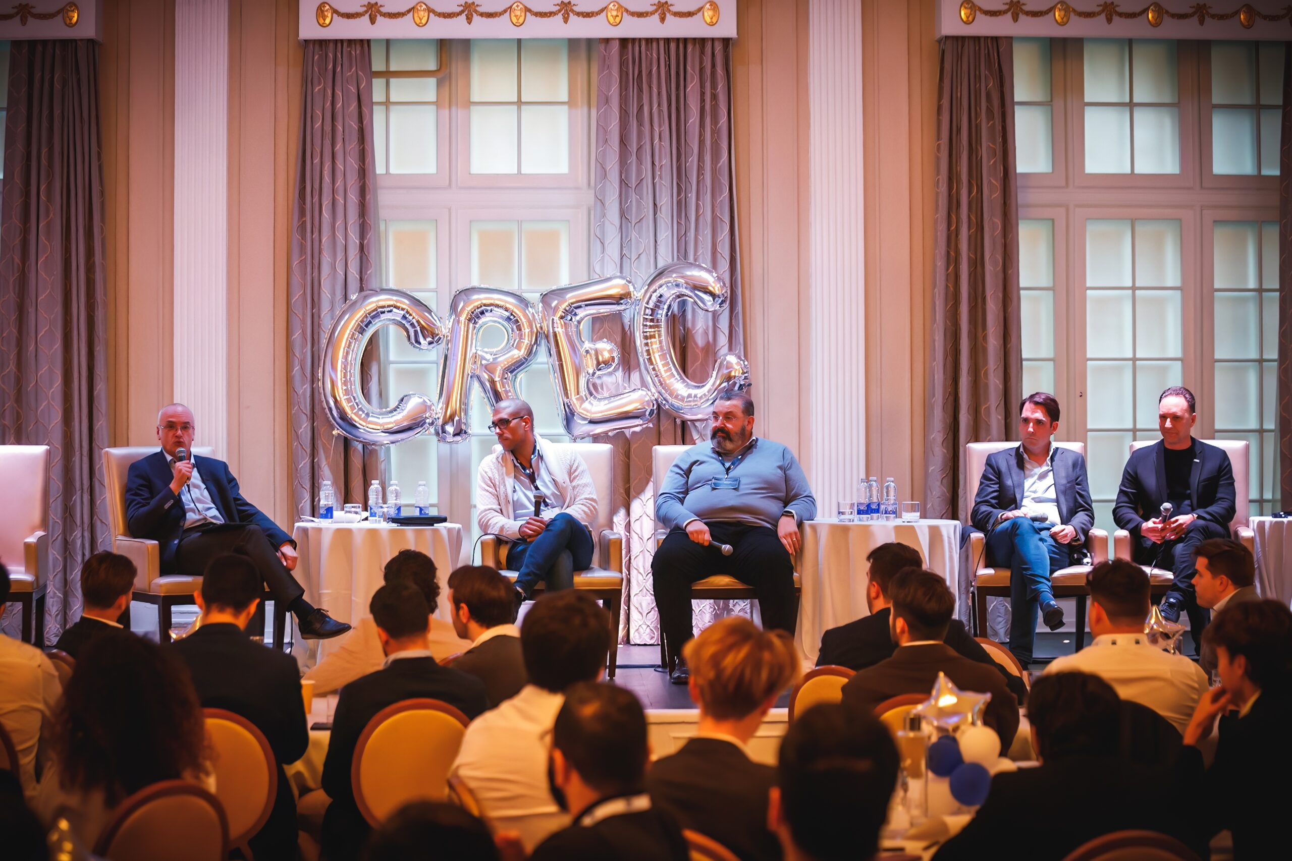 Panel discussion at CREC's Real Estate Conference, featuring experts sharing insights on critical real estate topics.